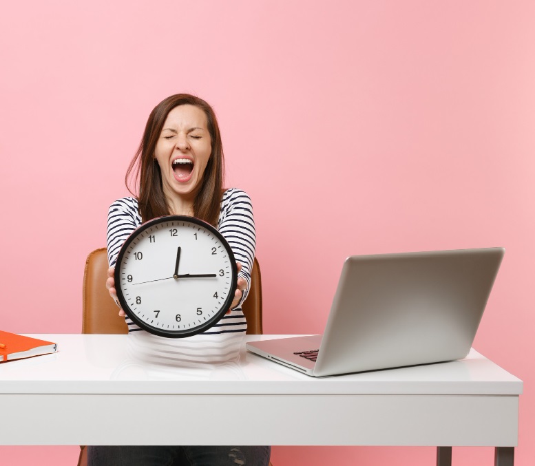 young-woman-screaming-holding-round-alarm-clock-while-sit-work-white-desk-with-pc-laptop.jpg